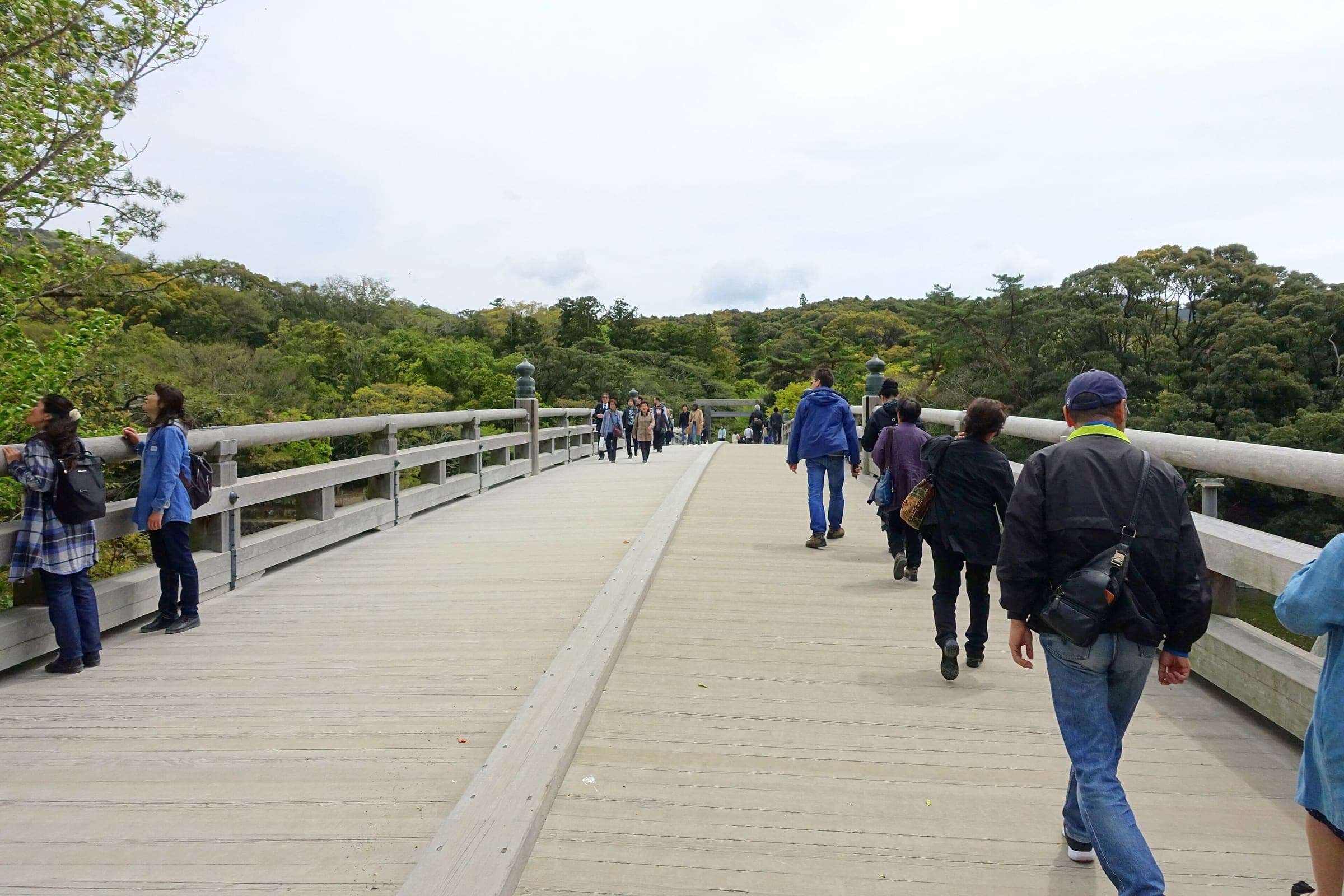 Visitors cross the broad Uji Bridge at the entrance to the inner shrine grounds of Ise Jingu
