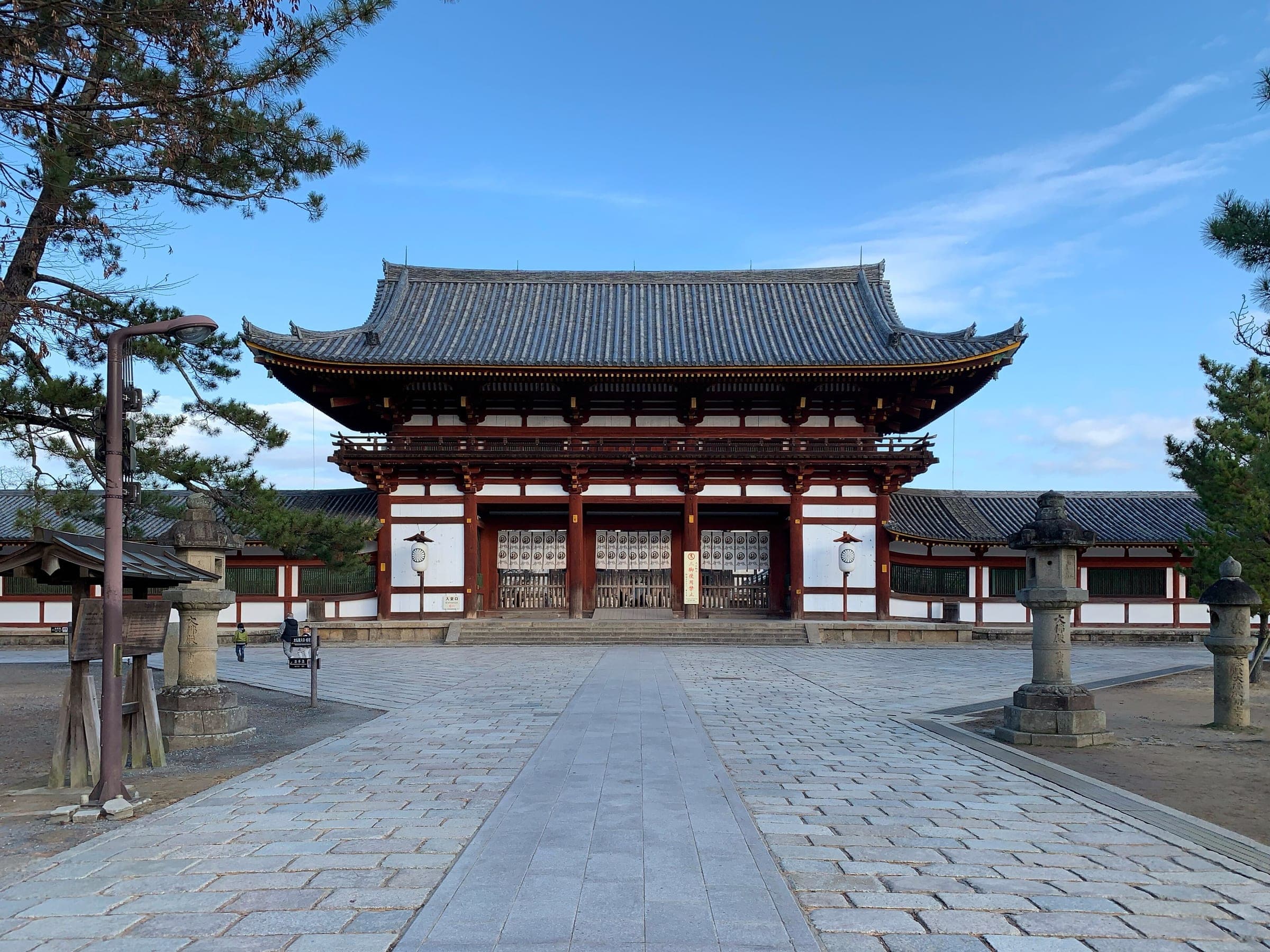 The vermilion Chumon gate of Todai-ji stands at the end of a broad stone forecourt in January