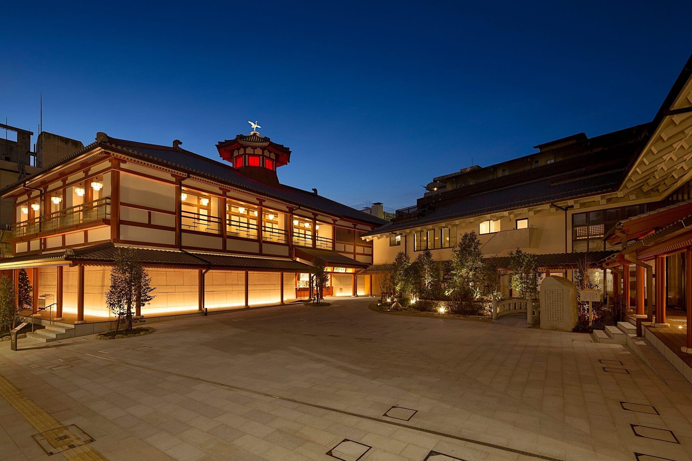 Lanterns light the courtyard of Dogo Onsen Asuka-no-Yu after dark.