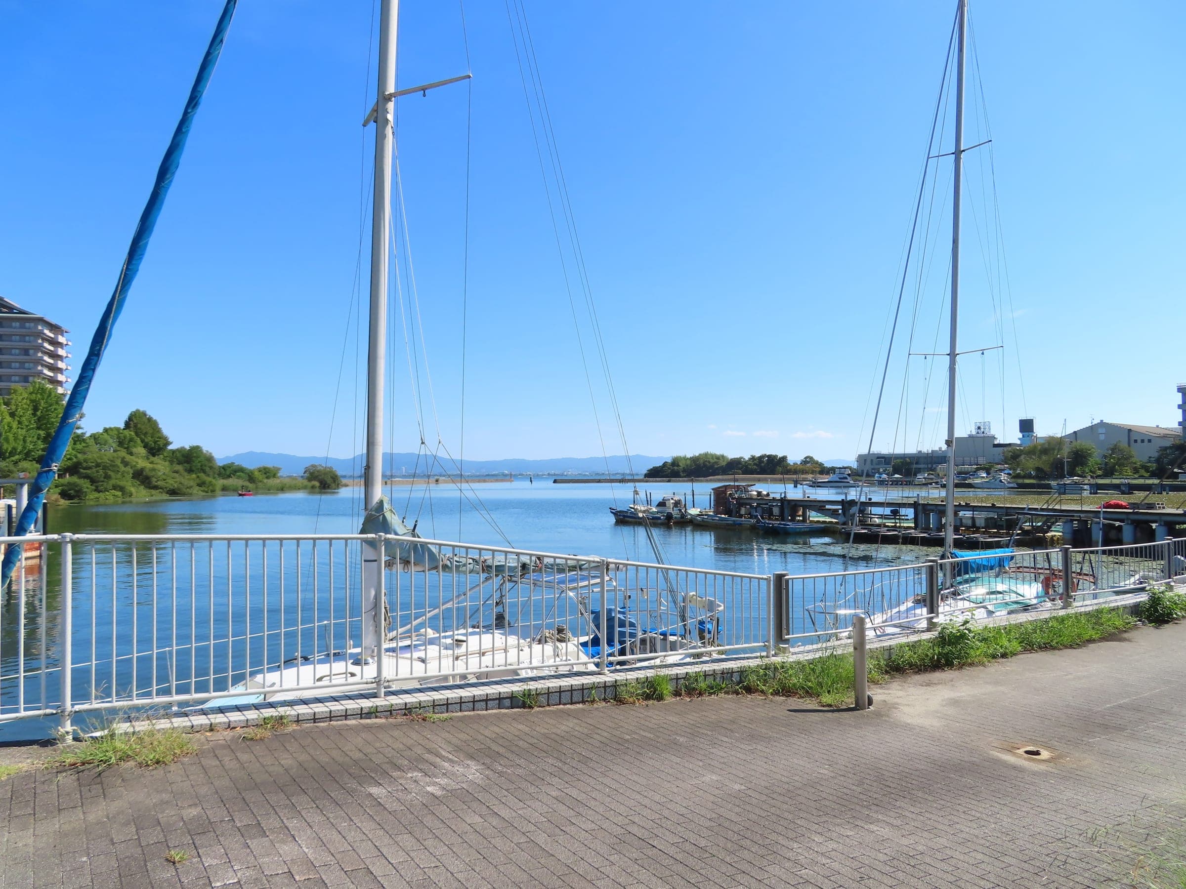 Sailboats sit in the small port at Ogoto Onsen on the calm southwest shore of Lake Biwa