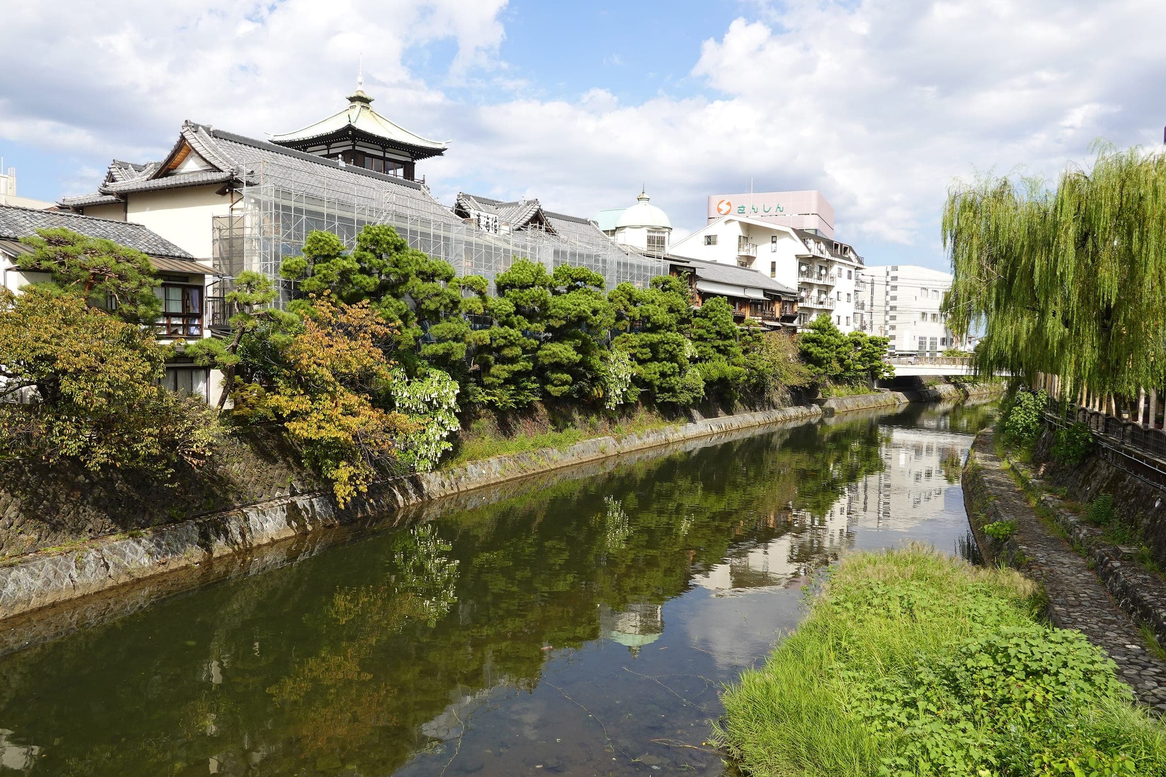 A copper-roofed lookout tower crowns the old wooden Tokaikan ryokan building in Ito.