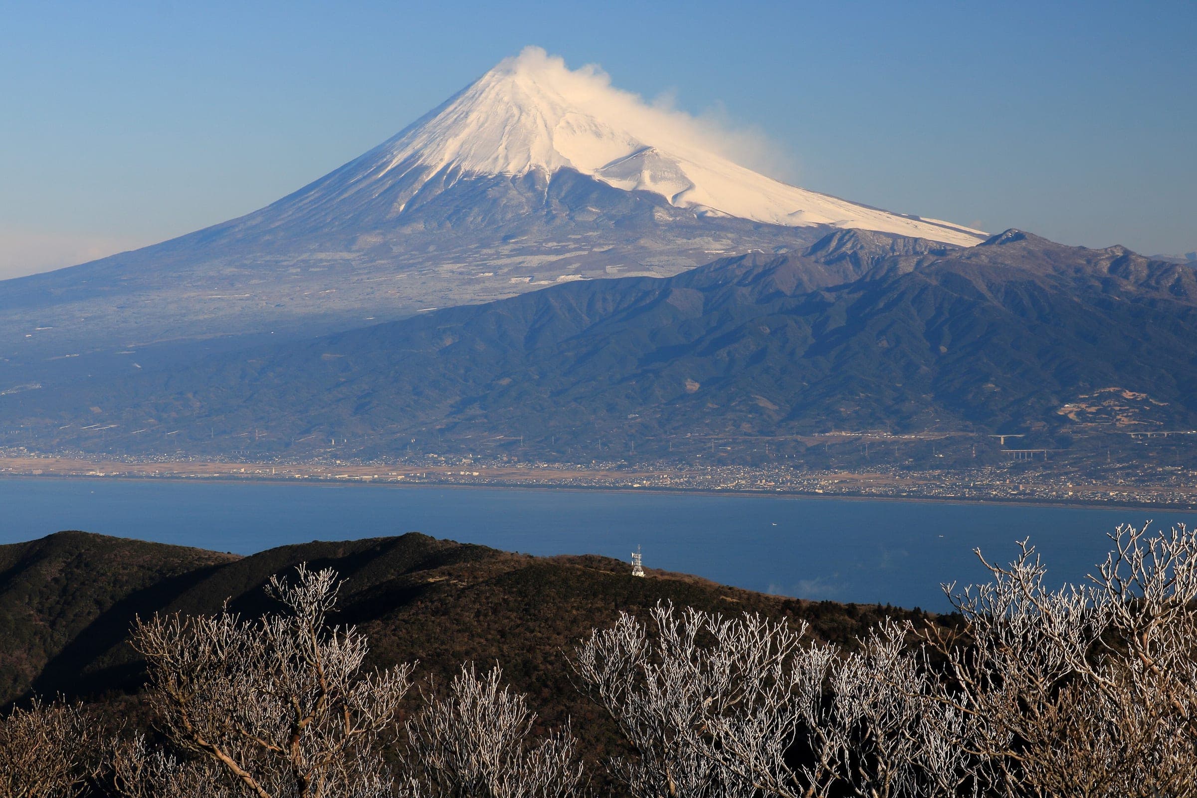 Snow-capped Mount Fuji rises above Suruga Bay in a February view from Mount Daruma in western Izu