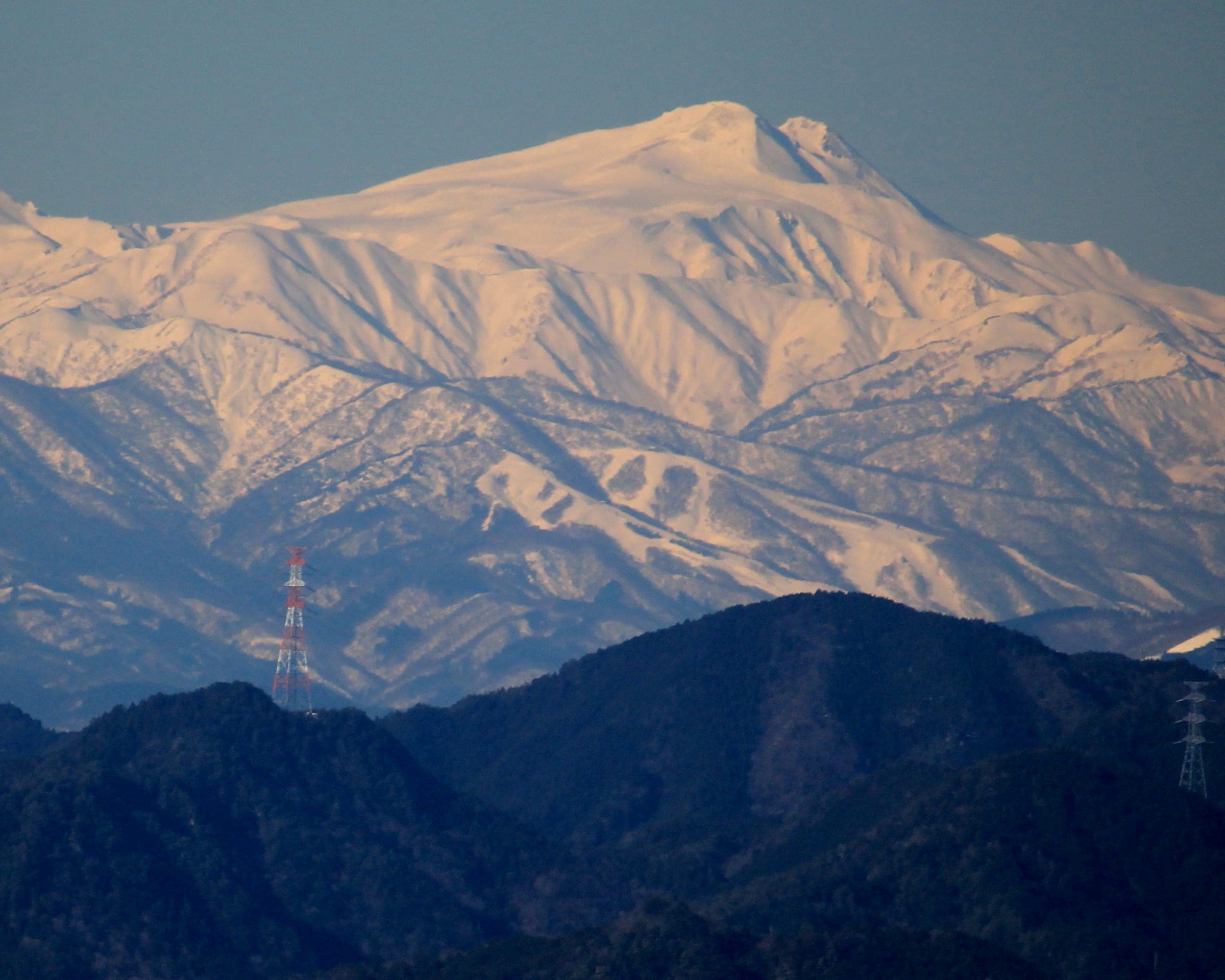Evening light turns the snowfields of Mount Dainichi above Takasu Snow Park and Dynaland pink