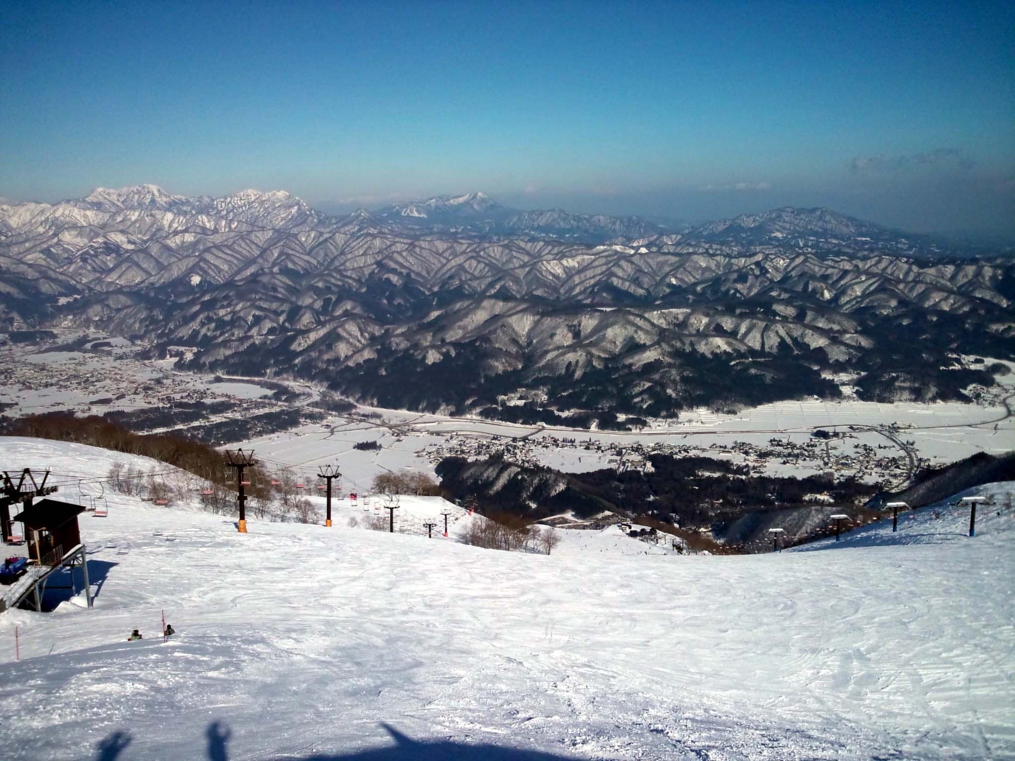 The top of Hakuba Goryu looks over the Hakuba valley to snowy ridges beyond