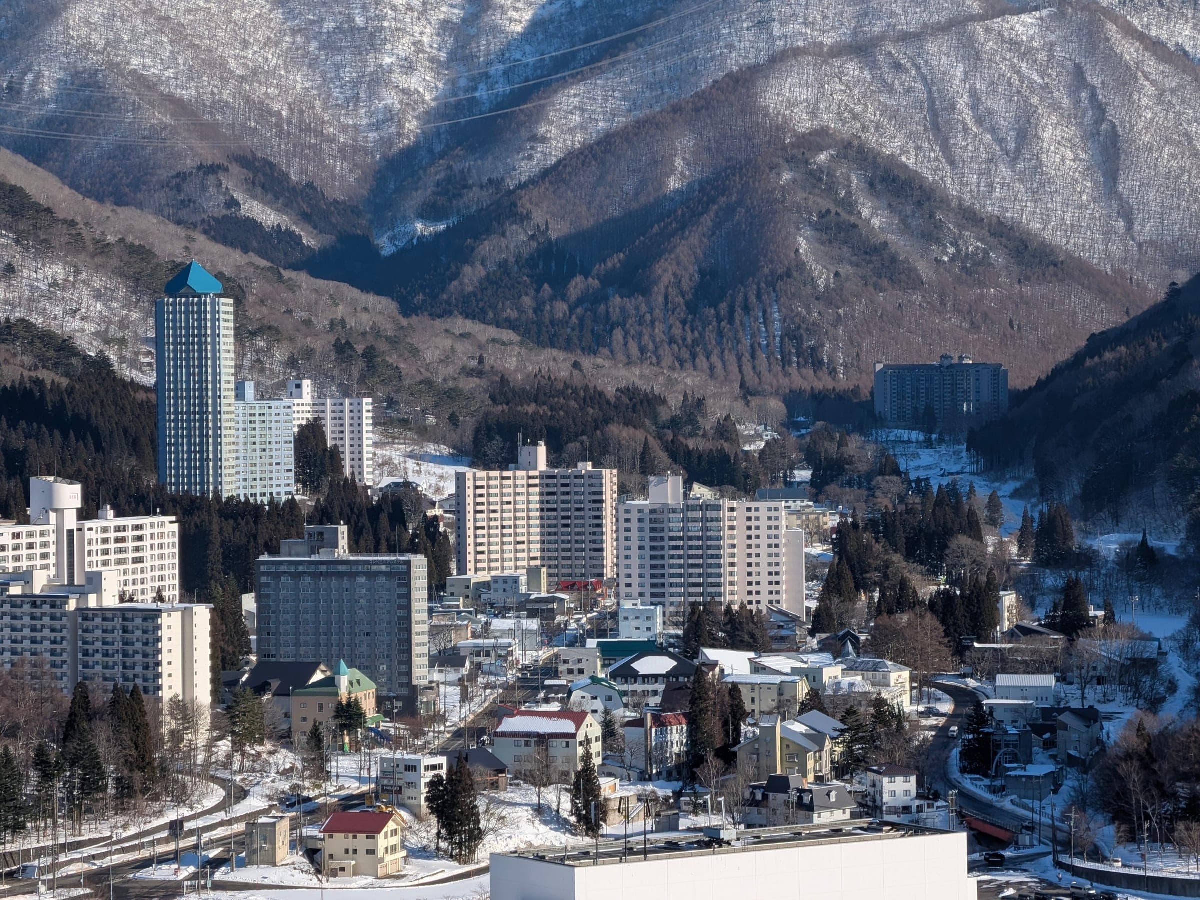 Naeba's hotel towers and lodges sit in a snowy valley below bare winter ridges