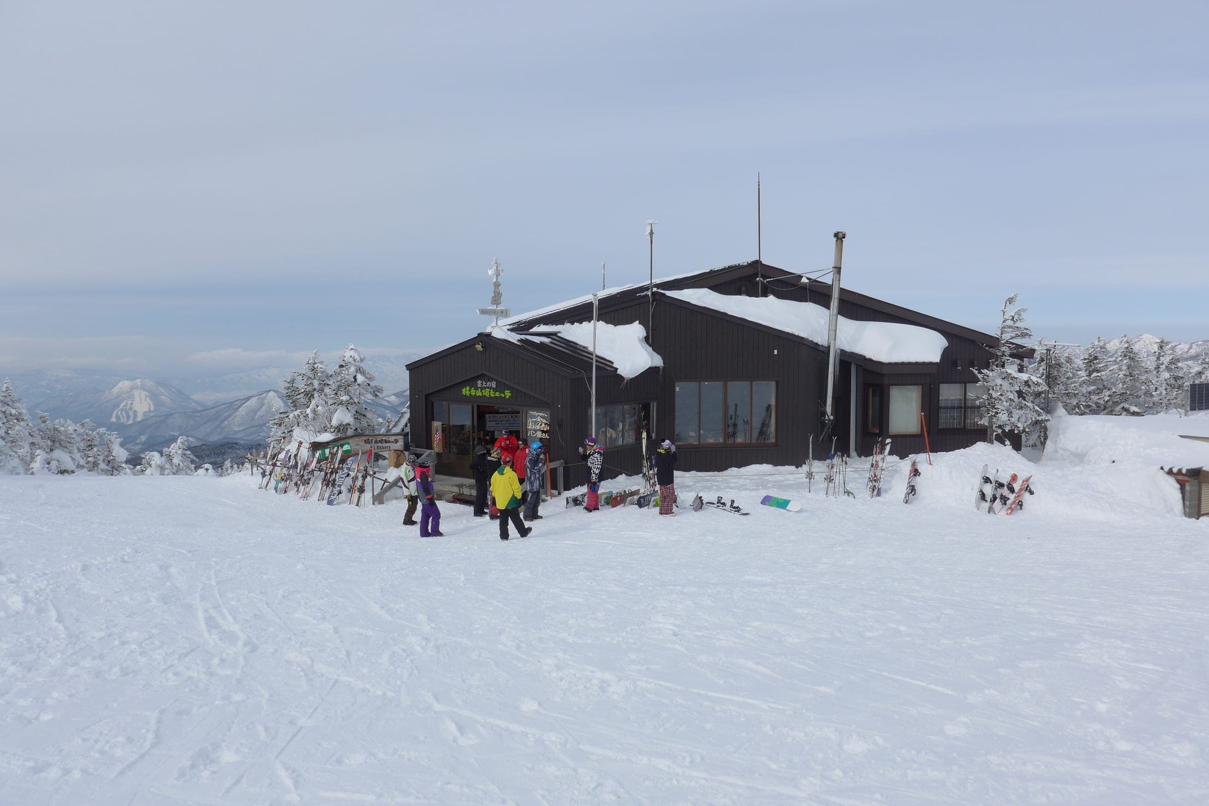 Skiers gather outside the Yokote Summit Hutte bakery near the top of Yokoteyama