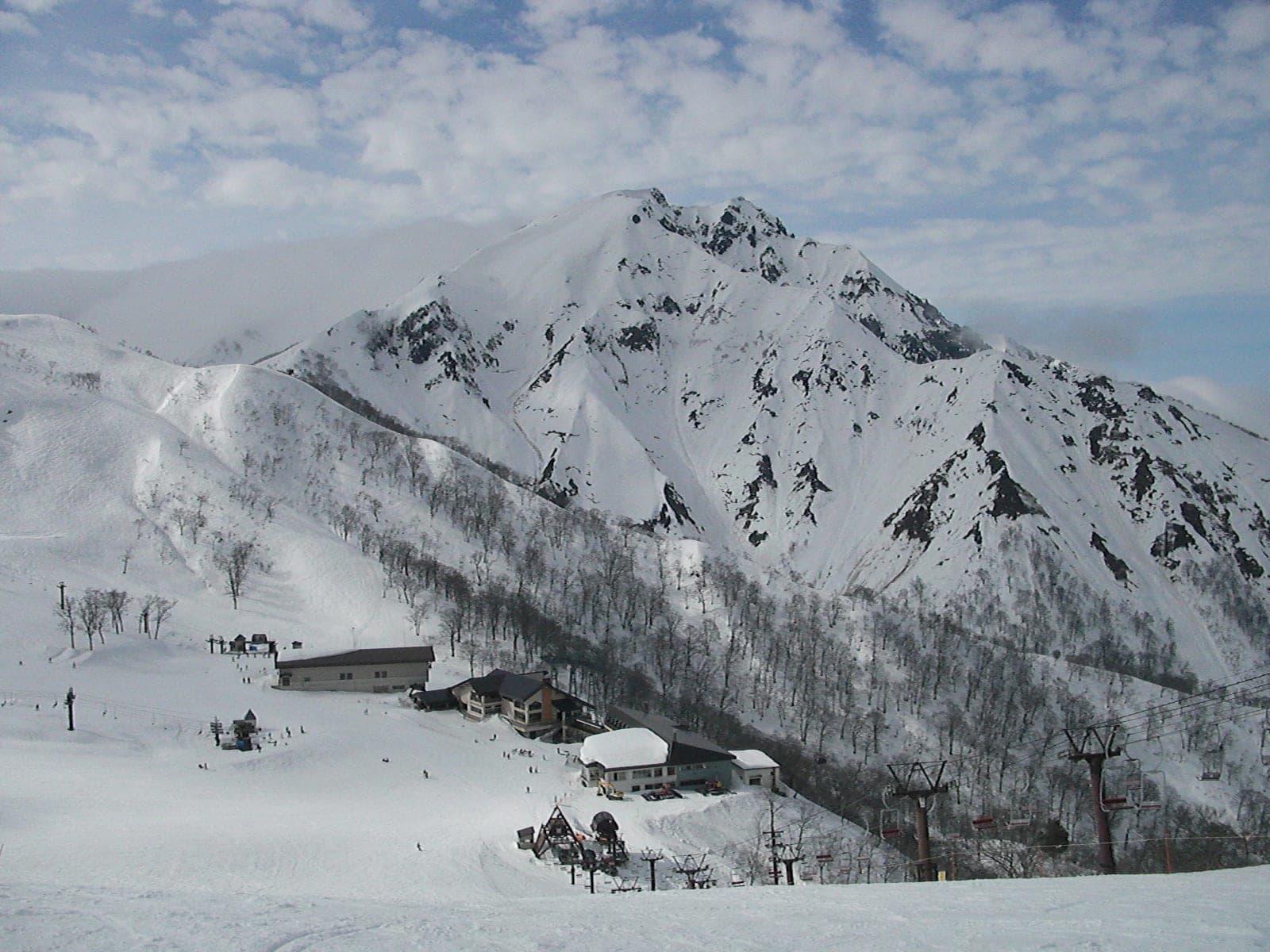 Tenjindaira's lodges and lifts sit below the snowy summit of Mount Tanigawa in February