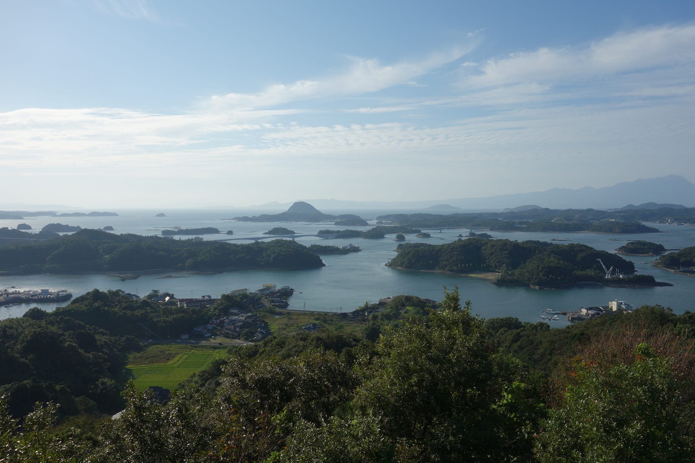 Wooded islands and bays of Amakusa Matsushima spread out below the hills along the Five Bridges road.