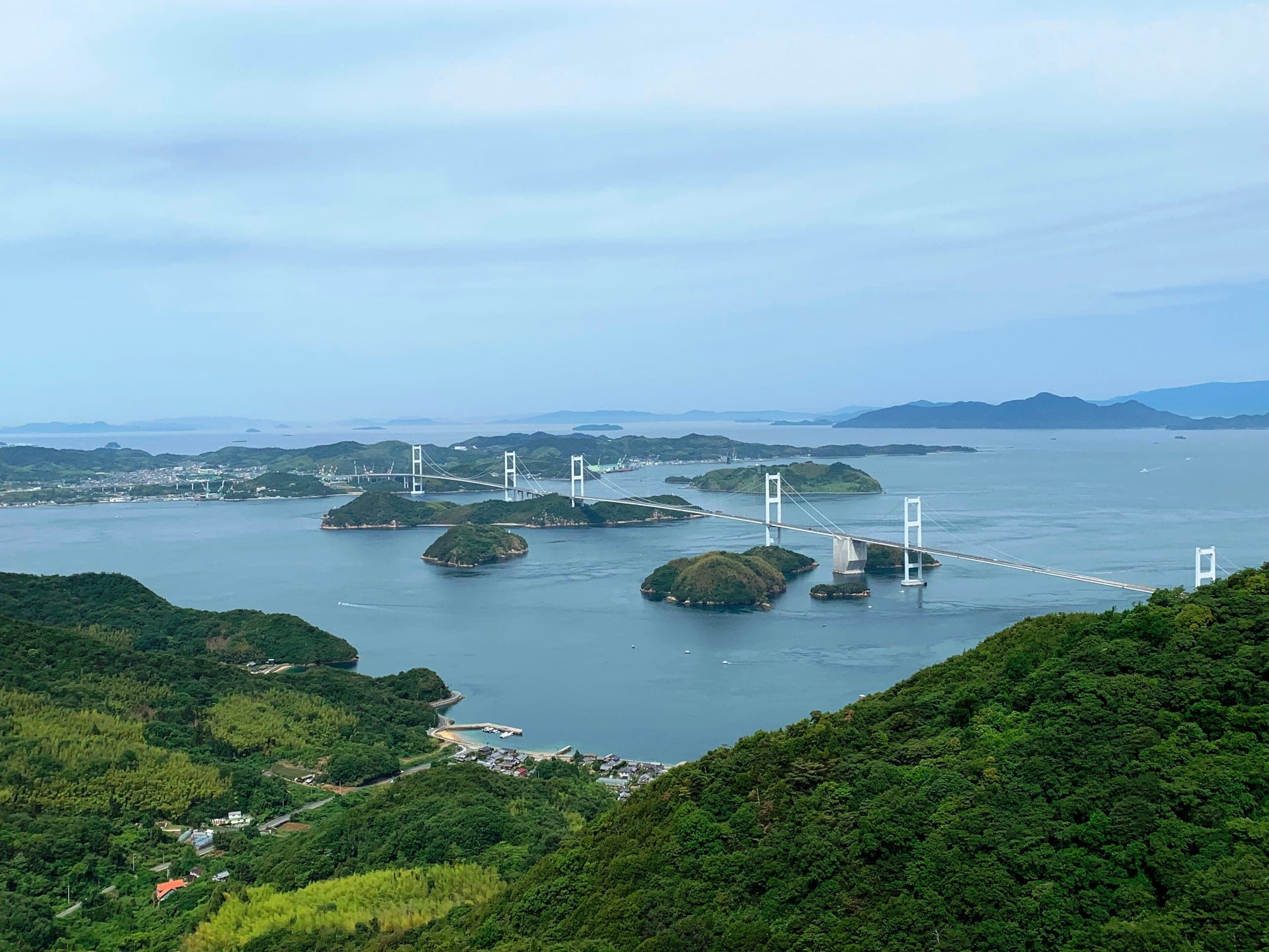 The three Kurushima-Kaikyo bridges cross the strait to Imabari, seen from Kirosan on Oshima.