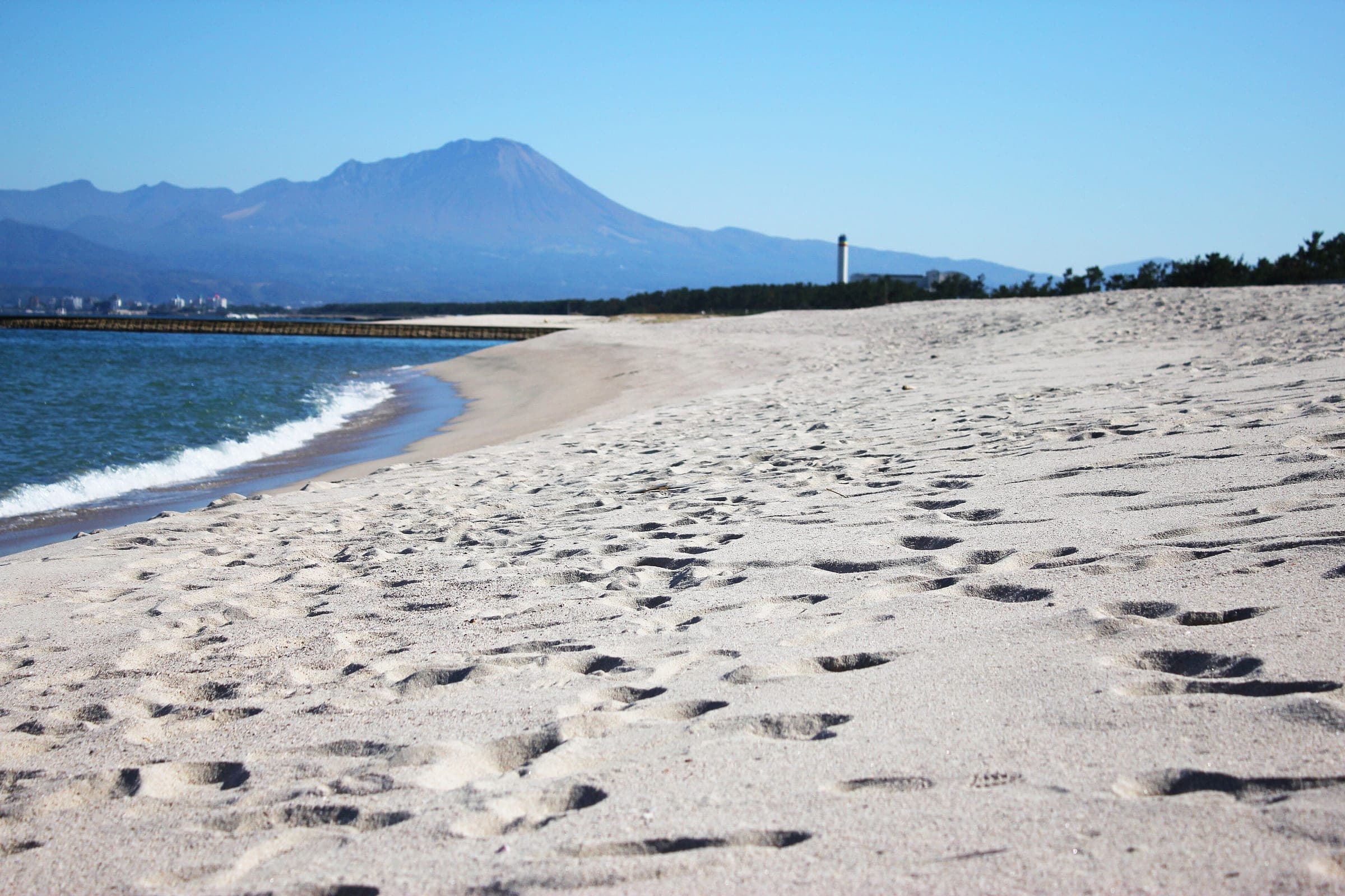 Mount Daisen rises beyond the white sand of Yumigahama beach near Yonago