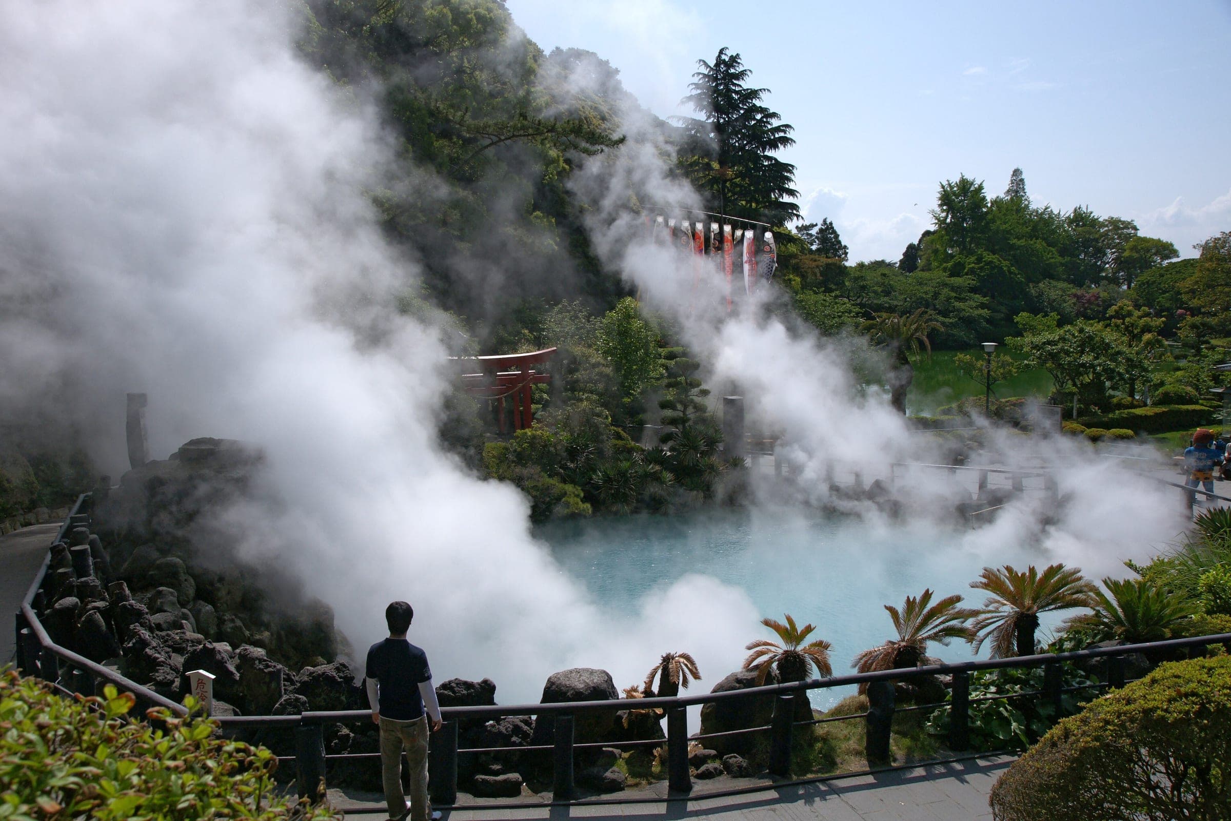 Steam pours off the cobalt-blue pool of Umi Jigoku in Beppu's Kannawa district.