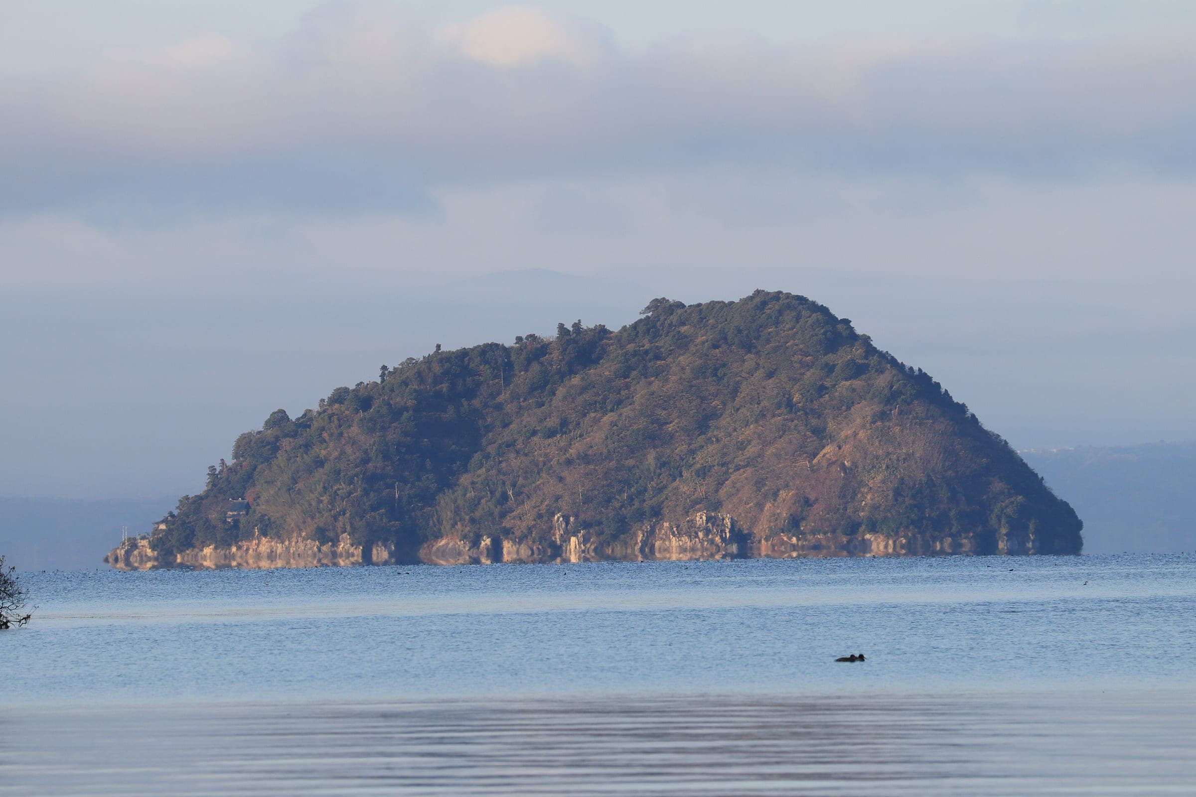 Chikubu Island sits low and wooded on Lake Biwa across the water from Nagahama