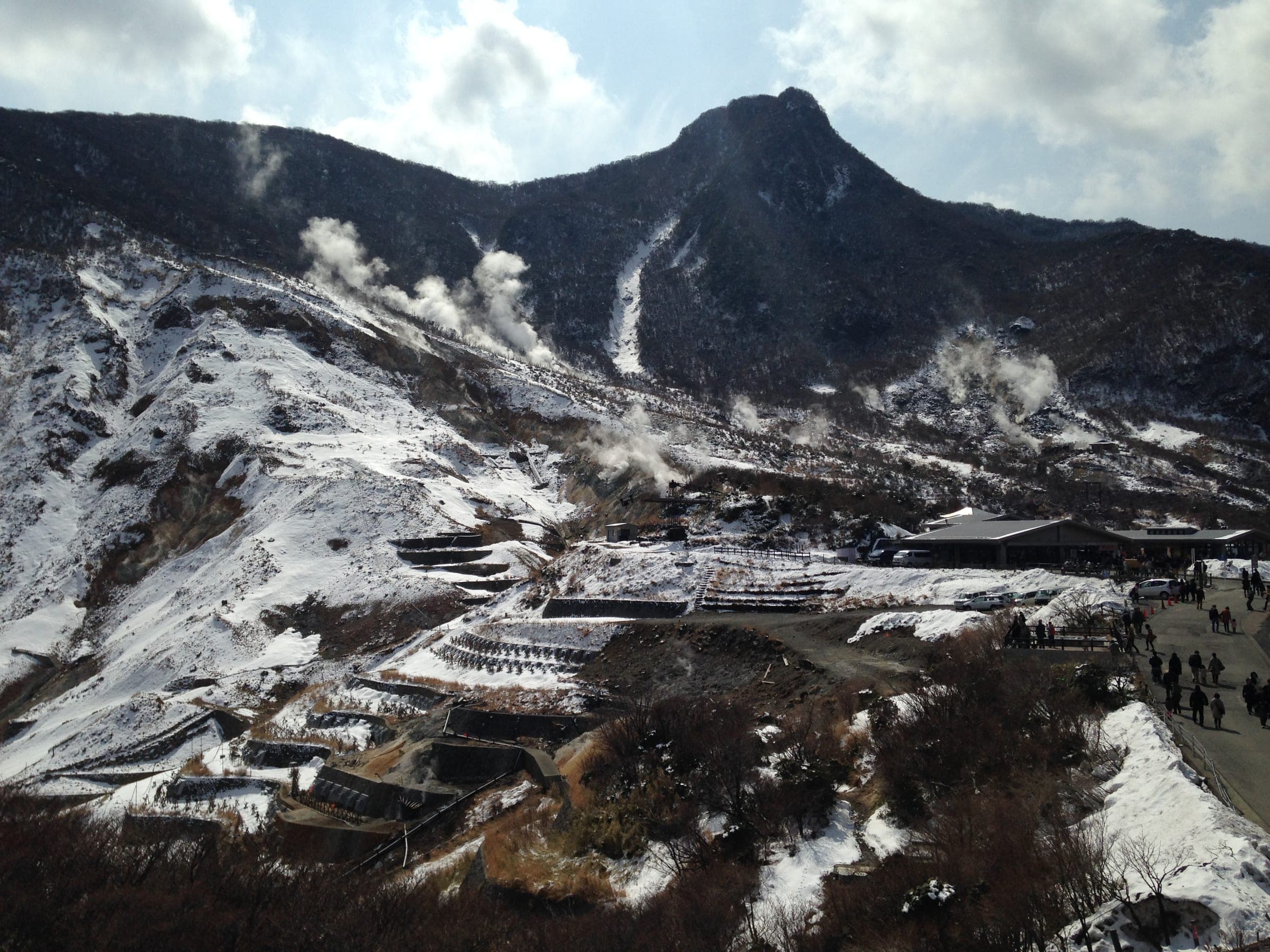 Snow lies across the steaming Owakudani valley below Mt. Kamuriga-take near the ropeway station.
