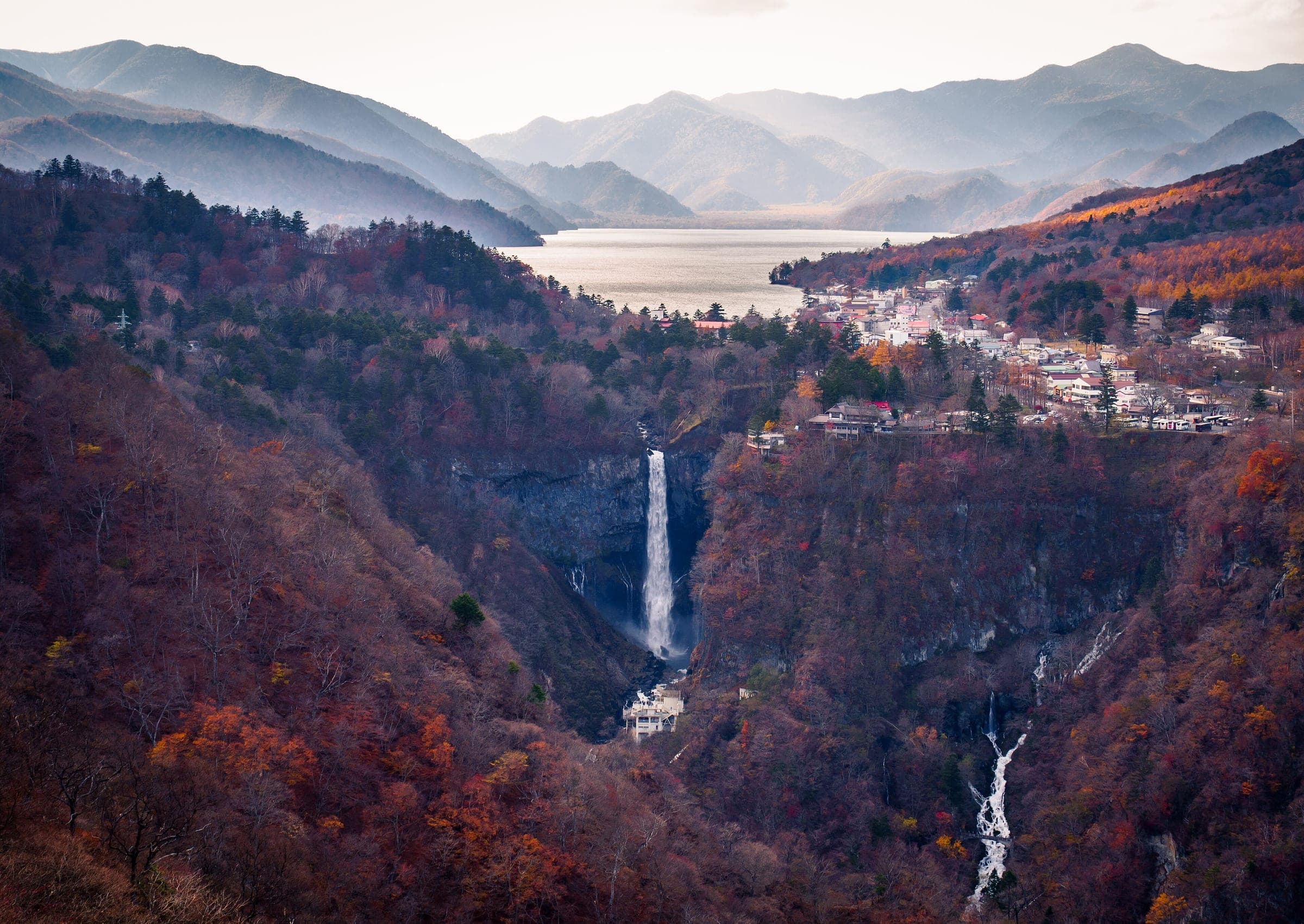 Kegon Falls spills from Lake Chuzenji into a gorge of autumn forest seen from above
