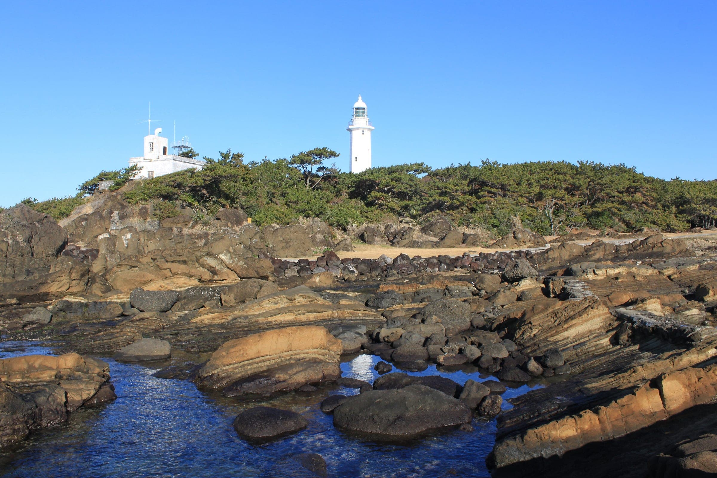 Nojimasaki Lighthouse stands above the layered rock shore at the southern tip of the Boso Peninsula.