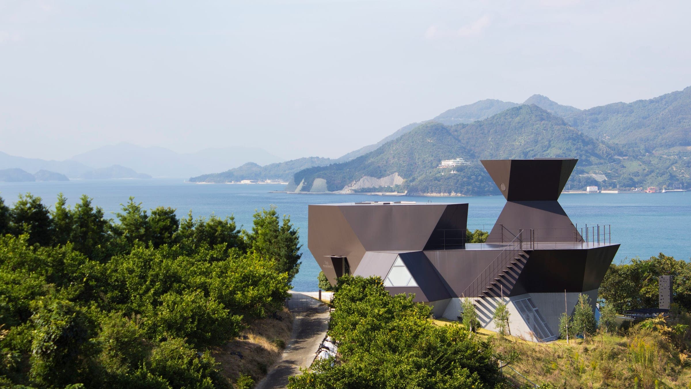 The angular Steel Hut of the Toyo Ito Museum looks over the Seto Inland Sea from Omishima.