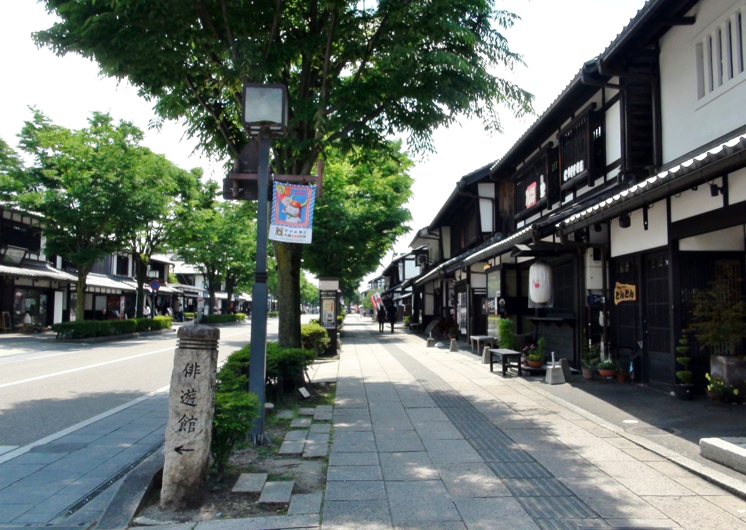 White-walled shops in the Edo style line Yume-Kyobashi Castle Road in Hikone