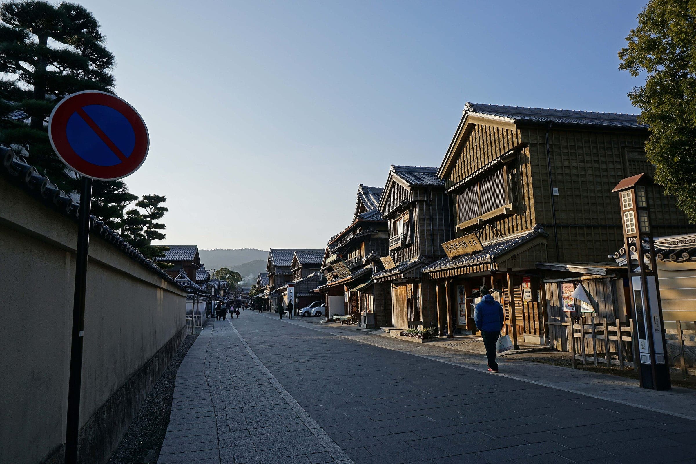 Early light falls on the empty timber-fronted street of Oharaimachi in Ise