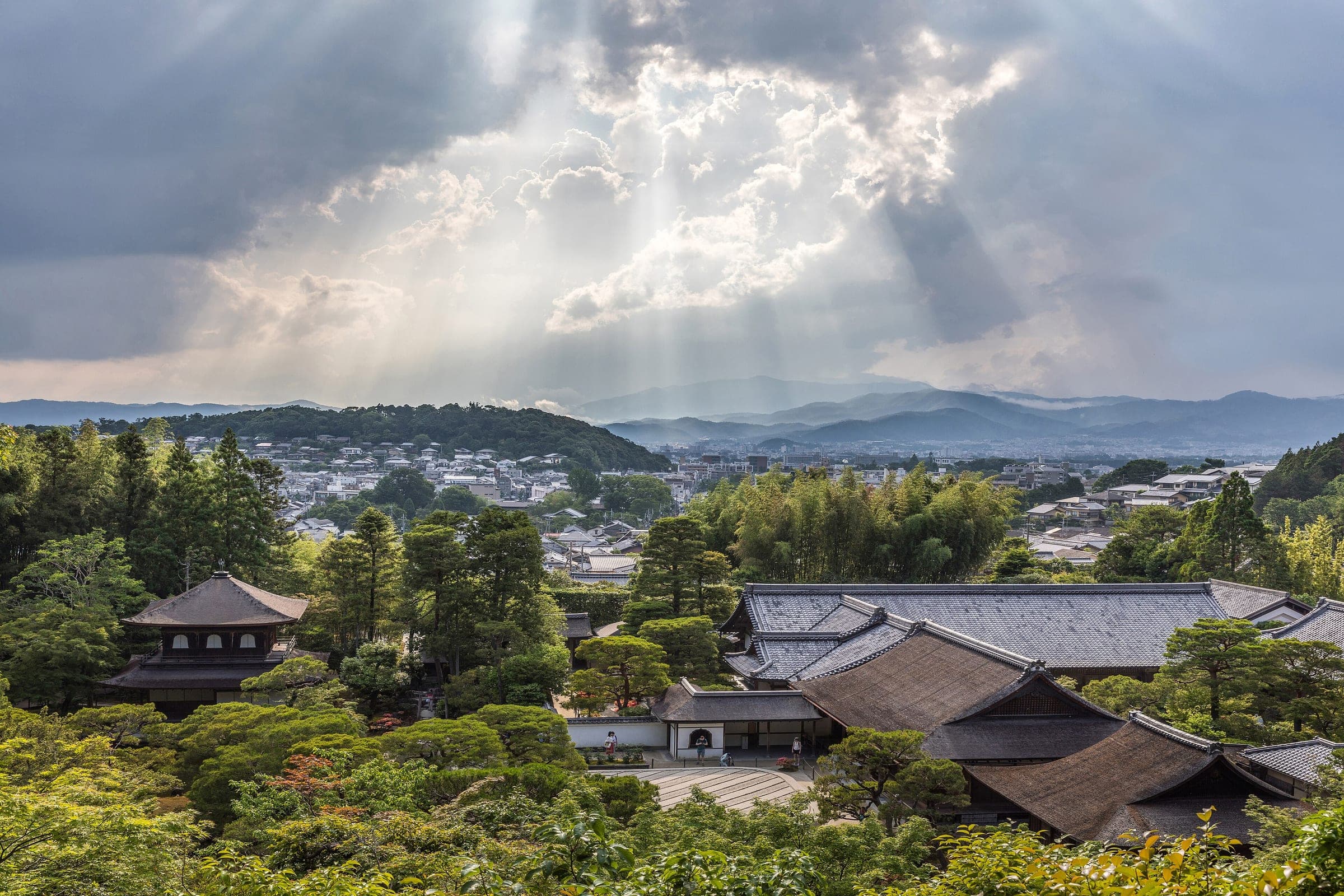 Sun breaks through cloud over Ginkaku-ji and the rooftops of northeast Kyoto