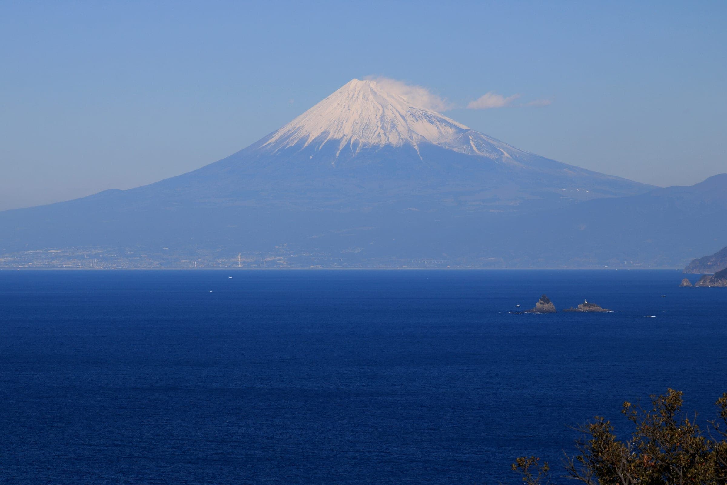 Mt. Fuji stands across Suruga Bay from the top of Mt. Eboshi in Matsuzaki on a January day.