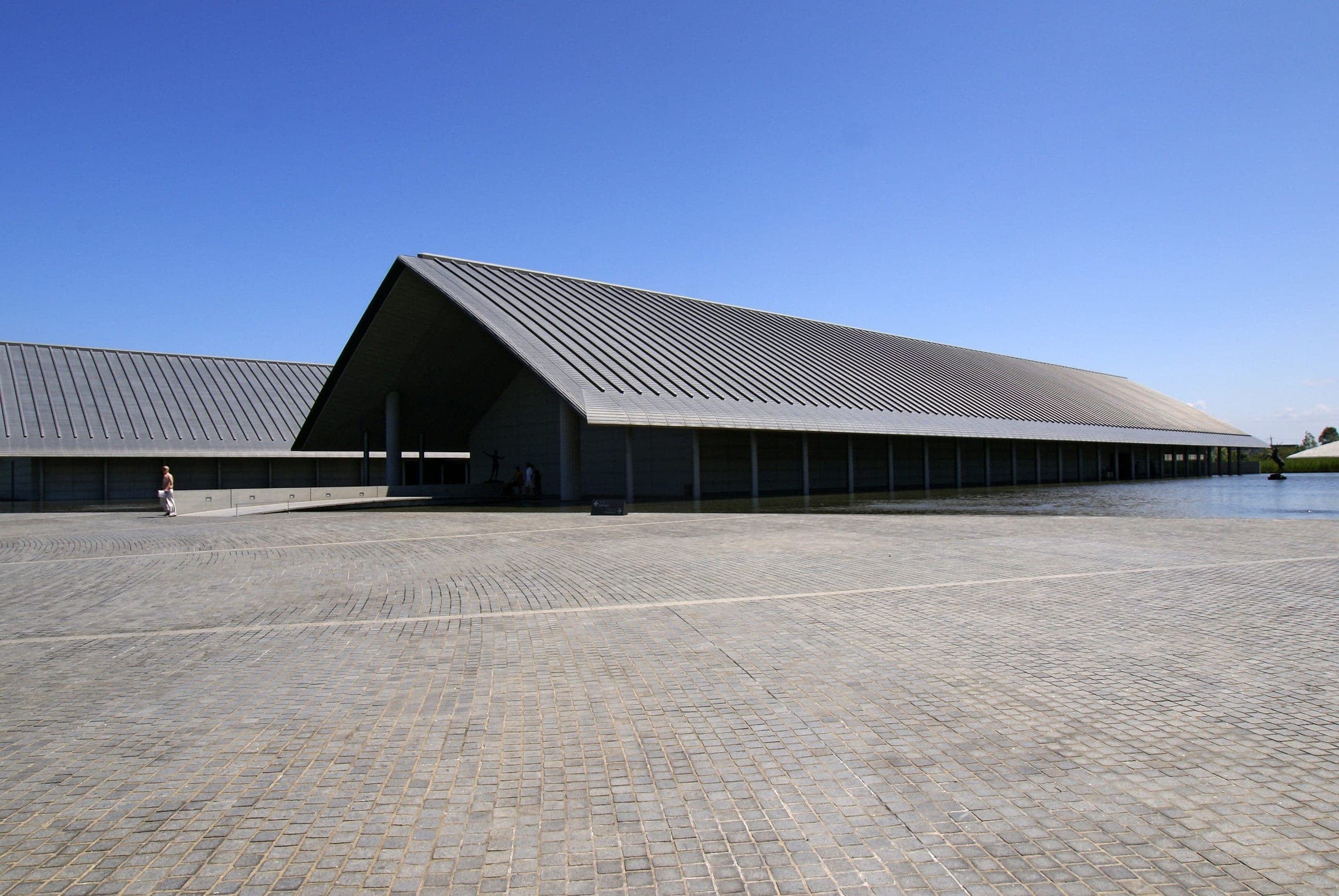 The low roofs of the Sagawa Art Museum in Moriyama float over its shallow reflecting pool
