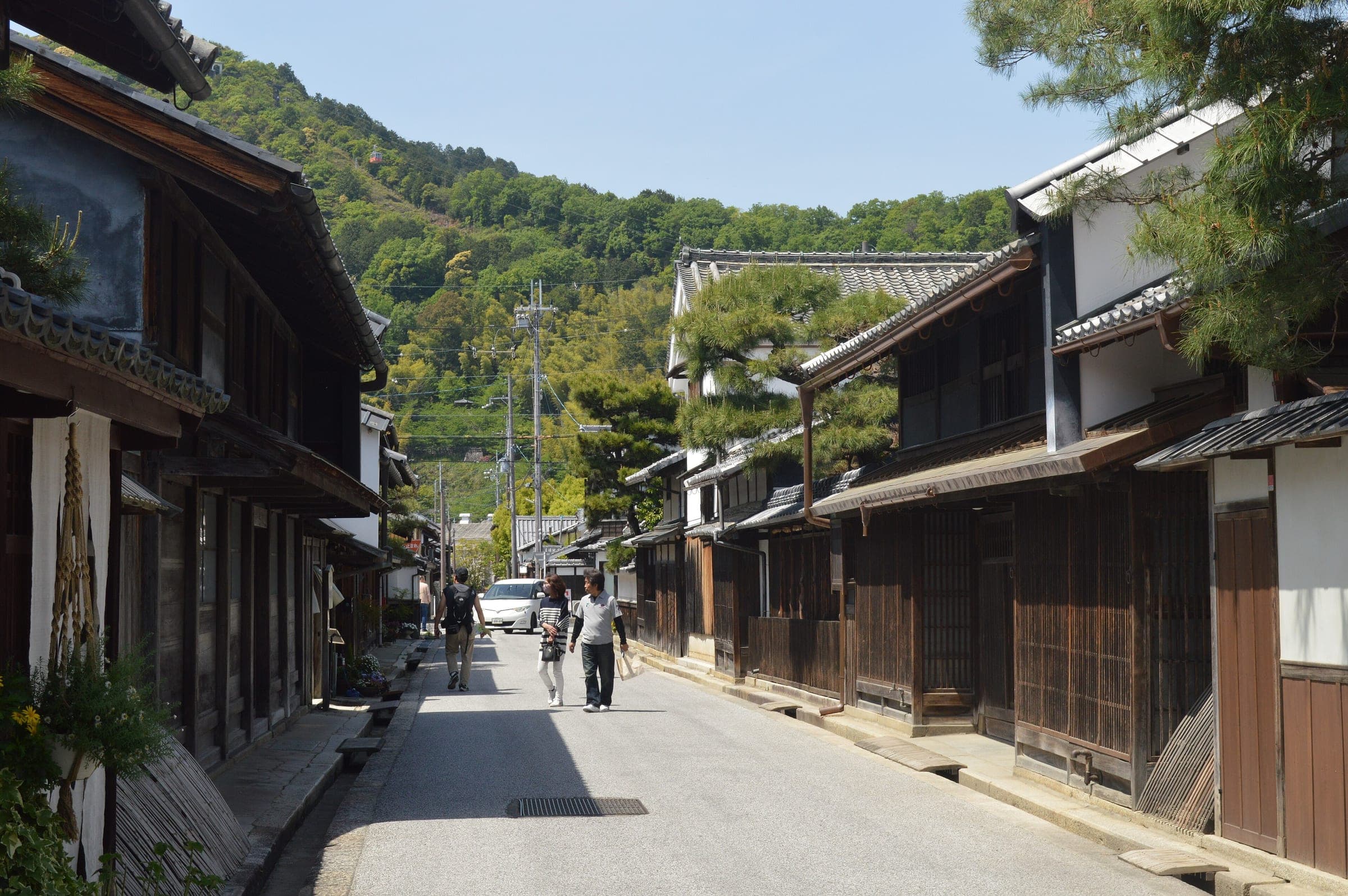 Dark timber merchant houses line Shinmachi Street in the old quarter of Omihachiman